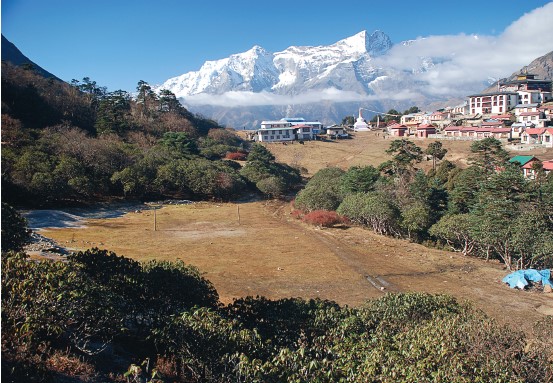 The same site in 2007. Note the increased forest and shrub cover, and how most of the original buildings in the upper center of the photograph had been removed and replaced by lodges at some time in the interim (photograph by A. Byers).